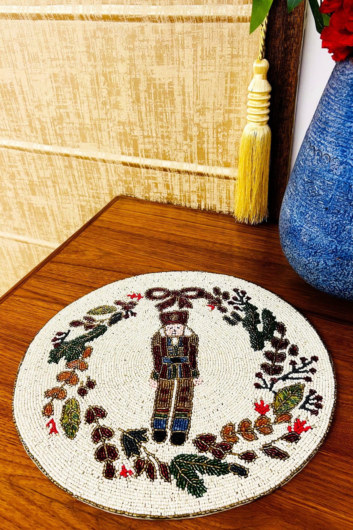 Handmade Beaded Placemat / Tablemat - 14" round | Nutcracker with Floral circular Wreath | Red, Green, Gold and White colour